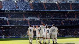 Real Madrid stroll past Granada to equal unbeaten record