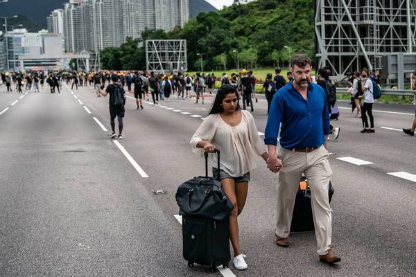 Hong Kong protesters block transport links to airport