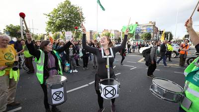 Climate change protesters block traffic junctions and promise more direct action