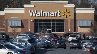 Wal-Mart cuts annual forecast as profits miss estimates