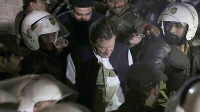 Police in Pakistan storm Imran Khan’s home as former PM travelled to appear in court