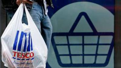 Tesco slashes profit forecast and dividend as trading slumps
