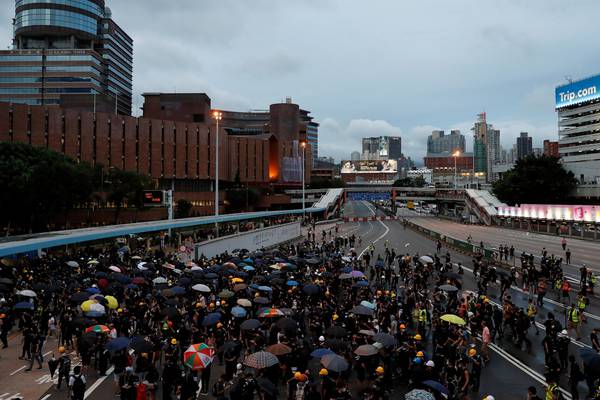 Hong Kong protesters ignore police and go past designated rally endpoint