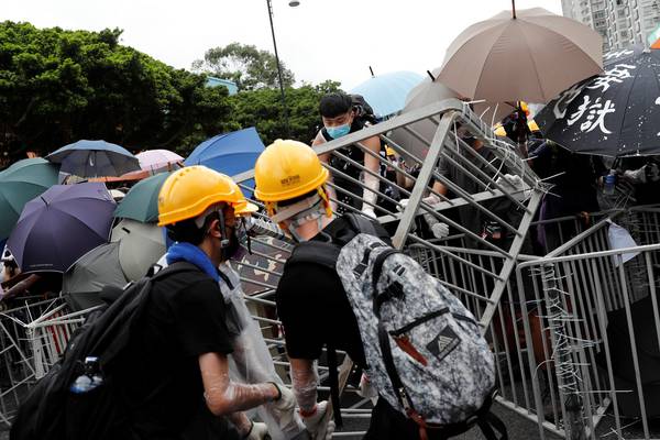Hong Kong extradition protesters escalate fight in suburbs