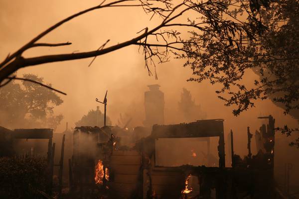 California wildfire kills three with 60,000 under evacuation orders