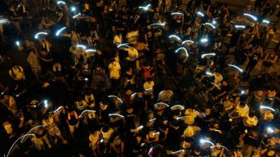 Riot police step back as Hong Kong protesters maintain pressure  on Beijing