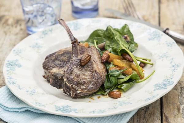 Grilled lamb chops with spinach, cumin, almonds and apricots