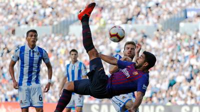 Barcelona ride their luck to sink Real Sociedad