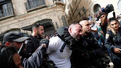 Israeli police baton charge mourners at Palestinian journalist’s funeral