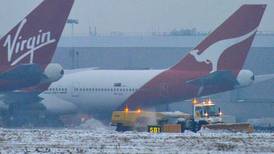 Qantas faces downgrade after profit warning