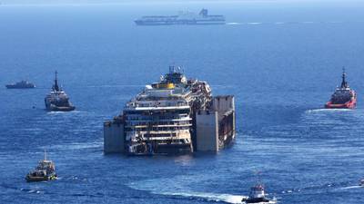 Costa Concordia out at sea with her ‘armada’ of  support boats