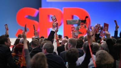 Temporary reprieve for Merkel as SPD votes for coalition talks