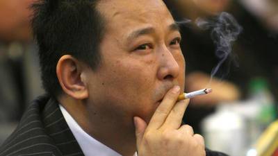 Former China magnate charged with murder and gun-running