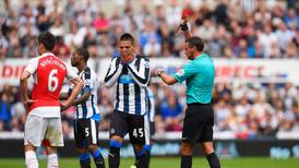 Arsenal grind out Newcastle win after early Mitrovic red card