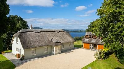 Thatched five-bedroom home overlooking Lough Derg, with boathouse and harbour, for sale for €1.4m