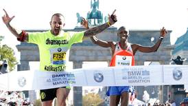 Wilson Kipsang lowers marathon world record in Berlin