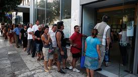 Greek unemployment dips but hovers near record highs