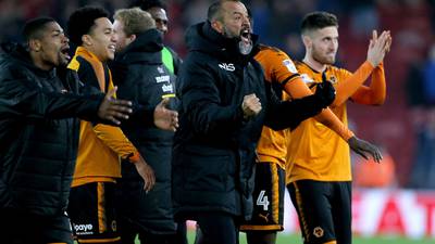 Wolves move closer to Premier League return despite red cards