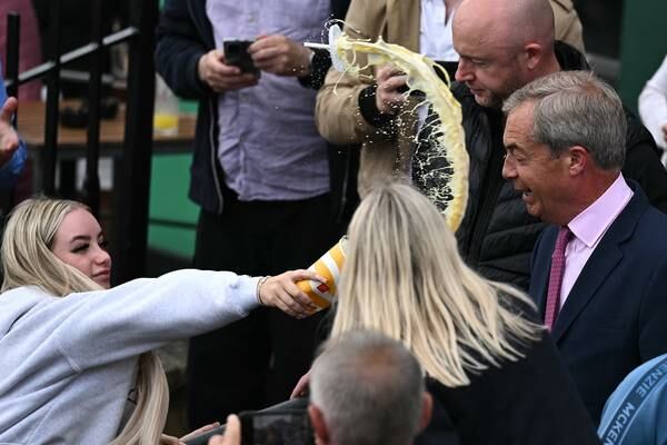 Woman (25) charged with assault and criminal damage after throwing milkshake at Nigel Farage