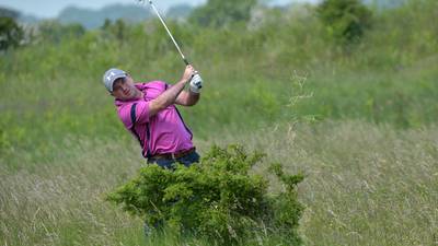 Colin Woodroofe putts it up to rivals to lead East of Ireland