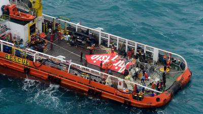 Indonesian search team raises tail of missing AirAsia plane