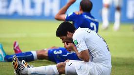 Uruguay’s Luis Suarez ducks  ‘biting’ incident
