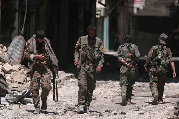 Syrian troops enter Kurdish-held town after Turkey threatens offensive