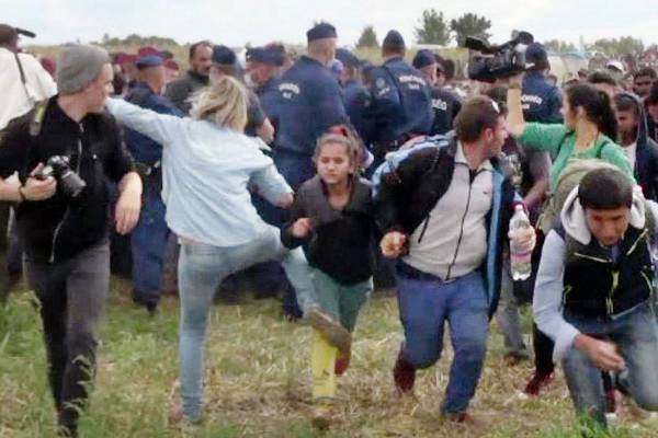 Camerawoman who kicked migrants sentenced in Hungary