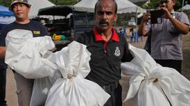 Malaysian police begin exhuming bodies at jungle camps