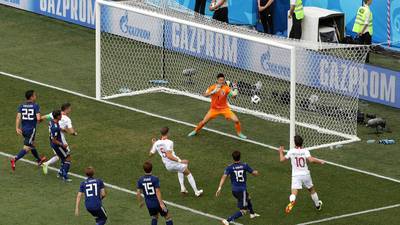 Japan squeeze through to last-16 despite Poland defeat