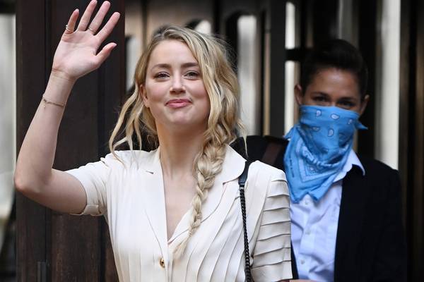 Amber Heard says ex-husband Johnny Depp threatened to kill her