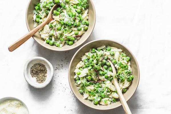 Olive oil is at the heart of this rustic soup-stew of orzo, peas, Parmesan and mint