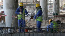 Qatar construction workers earn 55c an hour