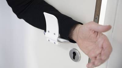 3D-printing firm releases hands-free door opener design for free