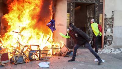 Bank burns, shops ransacked as Paris yellow vests regroup