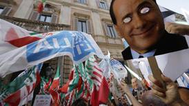 Protesters rally in Rome against ruling on Berlusconi