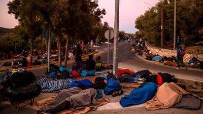 Thousands of migrants sleep on road in Lesbos after fires destroy Moria camp