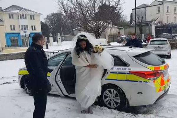 Bride makes it to the church in time - in the back of a squad car