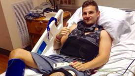 Berkeley survivor Jack Halpin raises a thumbs up