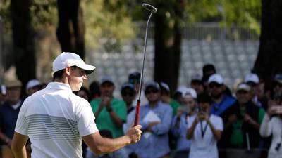Rory McIlroy makes light of illness and layoff to move into lead
