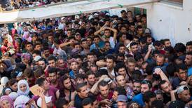 Migrants locked in stadium overnight on Greek island
