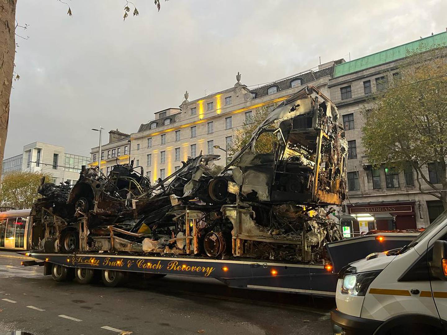Burned out vehicles and a Luas in Dublin city centre on Friday morning after rioting in the capital on Thursday night. Photograph: Conor Pope