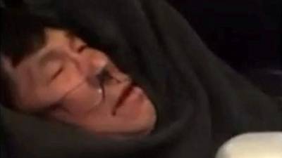 United Airlines reaches settlement with dragged passenger