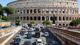 Italian police search for tourist filmed carving names into Colosseum wall