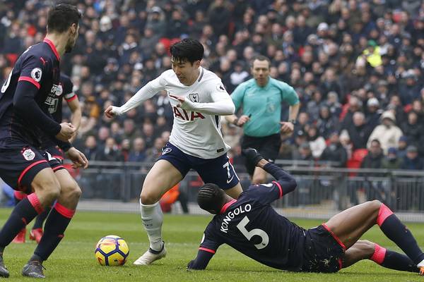Son on the double as Spurs coast past Huddersfield