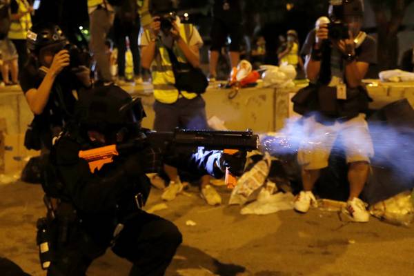 Hong Kong: Police fire tear gas to disperse protesters after day of chaos