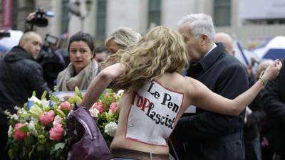 Femen activists disrupt Le Pen speech in Paris
