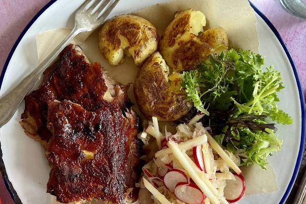 Pork ribs with crushed potatoes and apple sauerkraut slaw