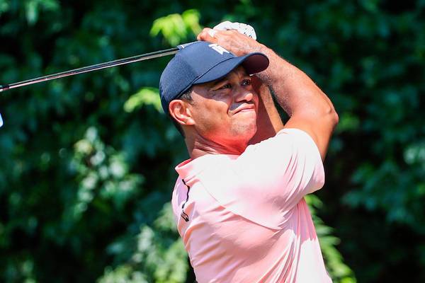 Tiger Woods in a share of the lead at Tour Championship