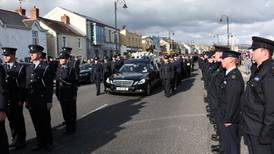 Streets at a standstill as Garda Golden is laid to rest